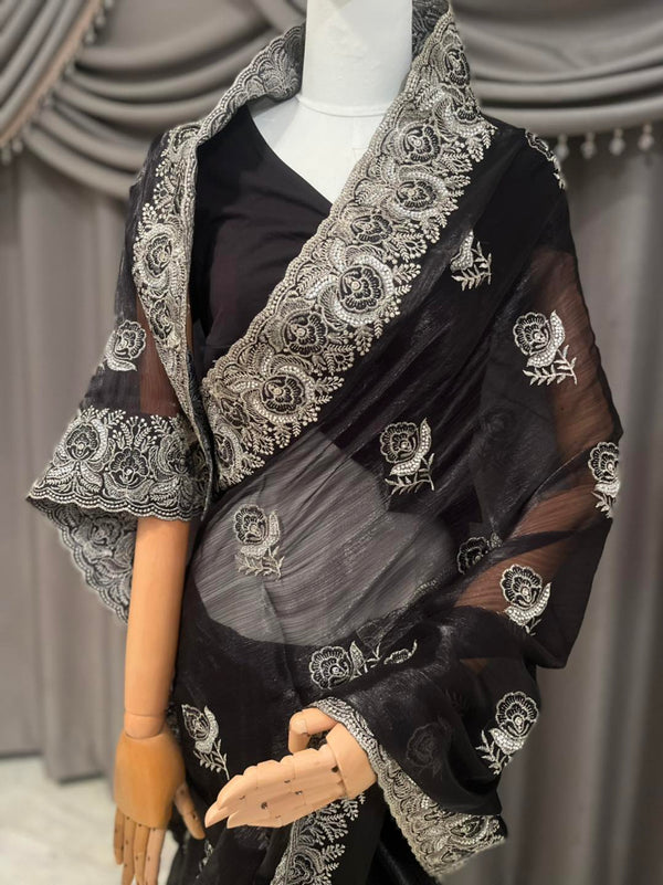 Classic elegance Black Jimmy Choo saree with stunning stonework and a matching blouse piece.